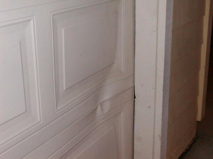 No more dented metal garage doors