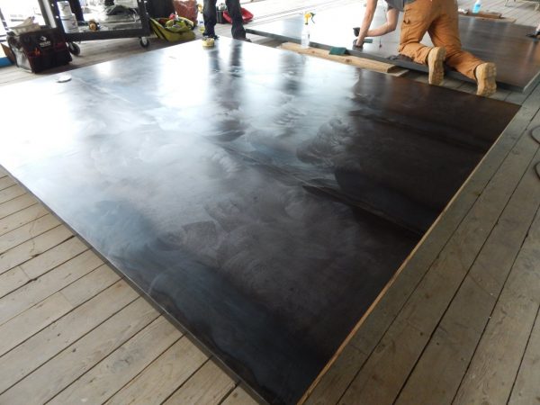 Hot rolled steel door being finished to install