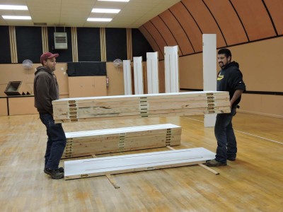 two men carrying a stack of 6 lightweight trade show panels high strength cam lock panels two men carrying a stack of 6 lightweight trade show panels high strength cam lock panels